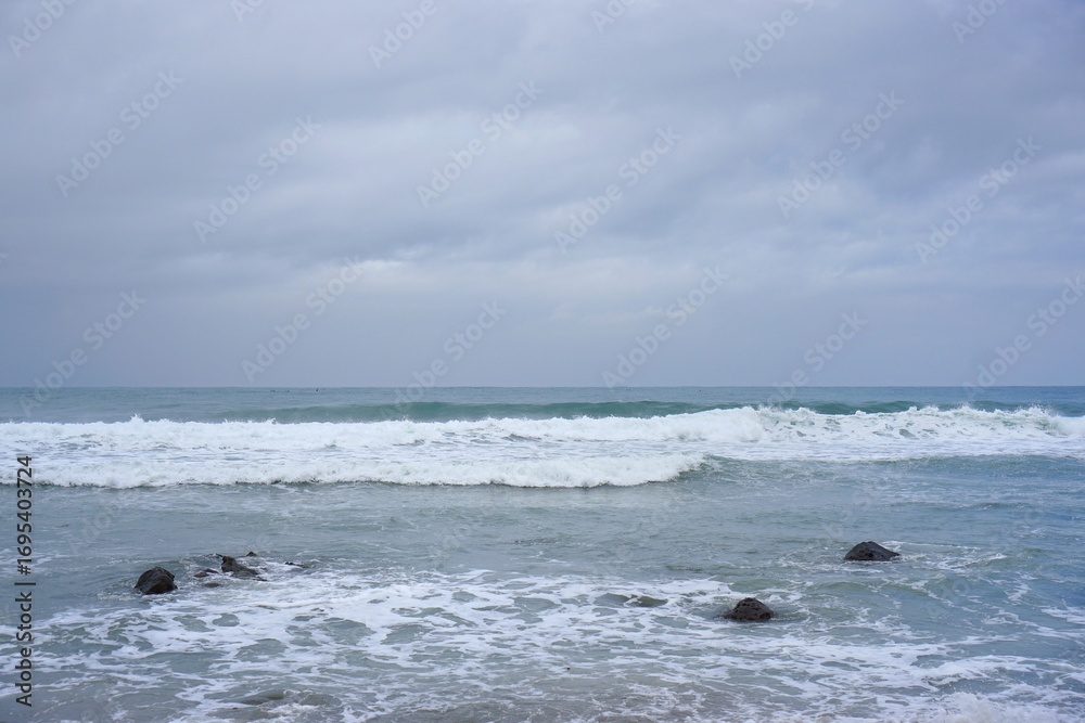 Obraz premium Waves crashing at Menganti beach Central Java Indonesia for coastal travel photography 