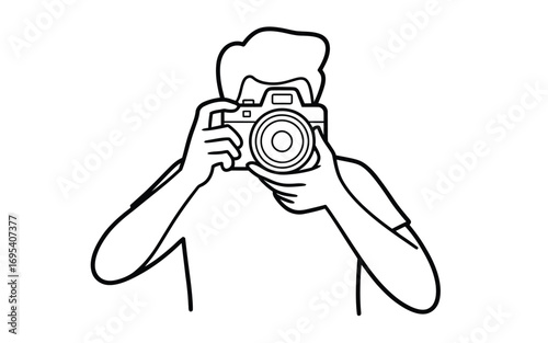 Person holding a camera and taking a photo