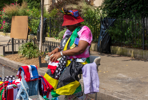 Vendor selling memorabilia at the West Indian Day Parade (Caribbean Day Parade) along Eastern Parkway, Brooklyn, NYC, USA. 