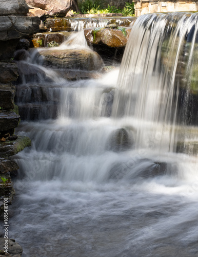 Close Up of a Manmade Waterfall Photographed with a Long Exposure in The Woodlands, Texas