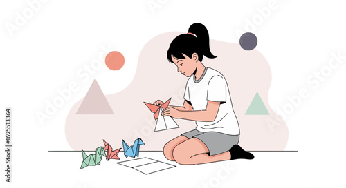 A girl sitting on the floor making origami cranes, hobbies and crafts activity