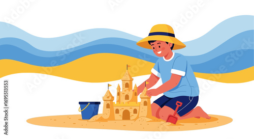 A happy boy building a sandcastle on the beach enjoying a summer vacation