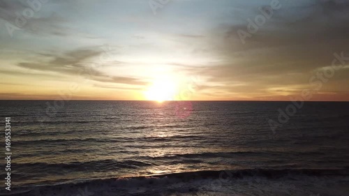 The beauty of the sunset at Kedungu Beach, Bali, seen from a drone