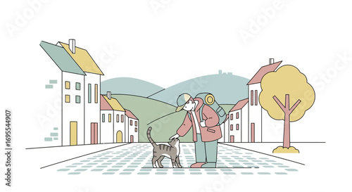 A Traveler Encountering A Feline Friend On A Cobblestone Street In A Charming Townscape