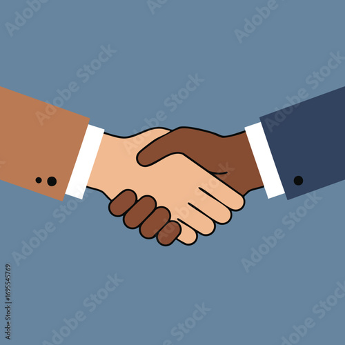 Two people shaking hands, a business deal or agreement.