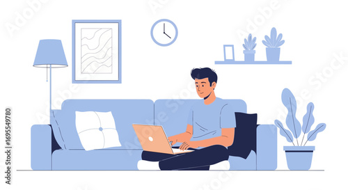 Young Man Working At Home Using His Laptop In Comfortable Living Room Setting