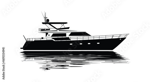 a sleek black yacht floating on calm water surface