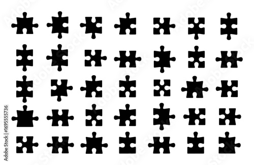 A Collection of Black Puzzle Pieces on a White Background