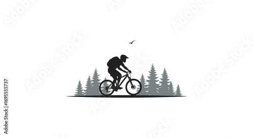 a cyclist rides through forest with bird flying above