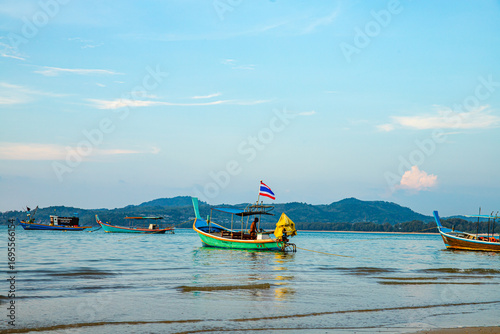 Tranquil Fishing Boats Resting on a Peaceful Beach at Sunset in Beautiful Thailand