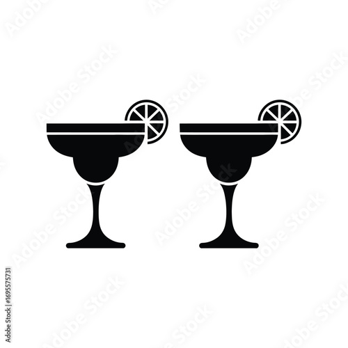 Two black silhouetted margarita glasses with lime slices
