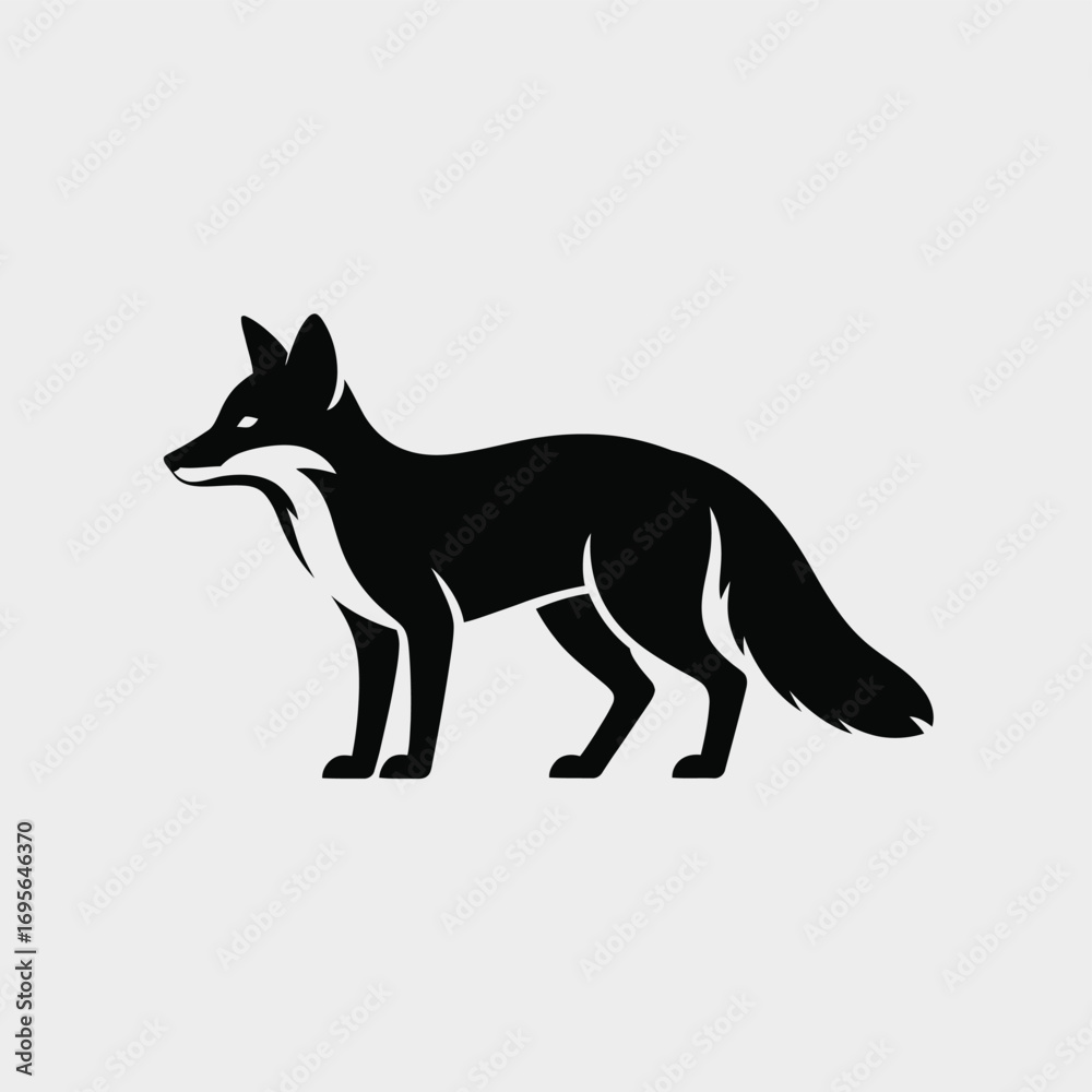 Fototapeta premium Black fox silhouette standing alert on a light gray background white animal