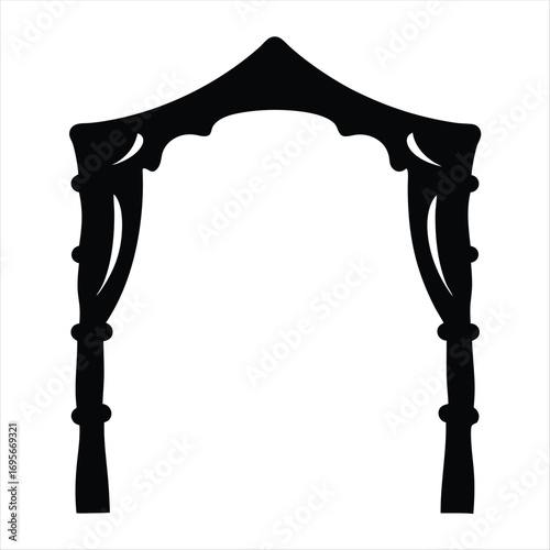 Silhouette of ornate archway structure with decorative columns and pointed top