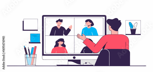 Person participates in a video conference on a desktop computer, shown from behind.  The screen displays three other participants. Workspace setting with simple background.