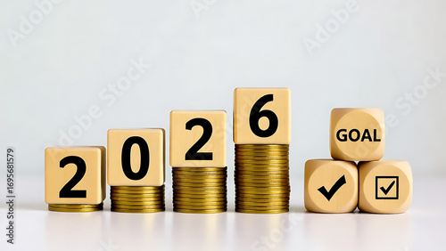 Wooden Blocks 2026 on Golden Coins with Goal, Plan, and Action Pyramid, Ideal for financial planning, New Year’s resolutions, or business development visuals.
