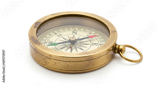 Antique brass compass, showing north, isolated on white background.
