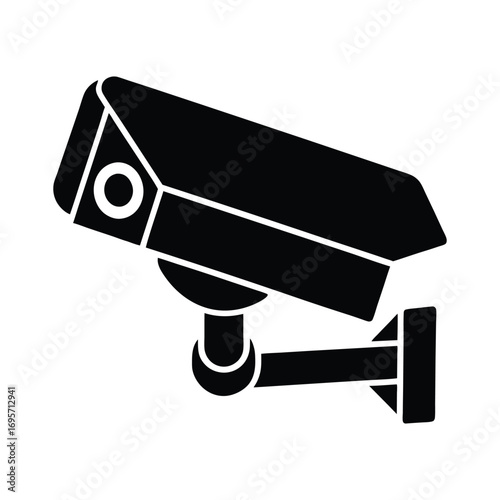 Black security camera silhouette mounted outdoors for surveillance and monitoring technology