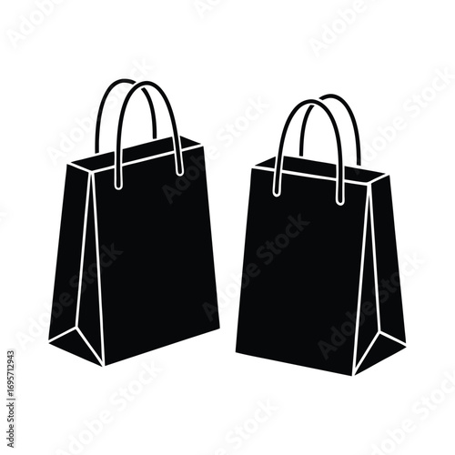Two black shopping bags with handles ready for purchases commerce retail convenience shopping