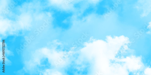 Blue sky with soft white clouds, natural background with fluffy cloudscape and clear atmosphere for peaceful design.