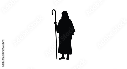 a shepherd silhouette holding staff standing tall