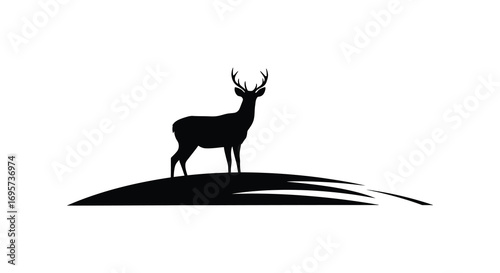 a majestic deer silhouette standing atop a hill
