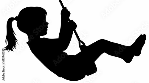 Silhouette of a young girl with a ponytail swinging on a rope swing in a playful and carefree manner outdoors