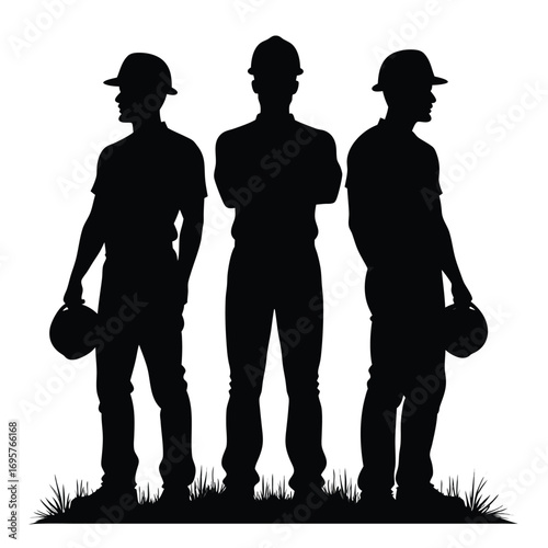 Three construction workers silhouettes with hard hats and grass Keywords: silhouette