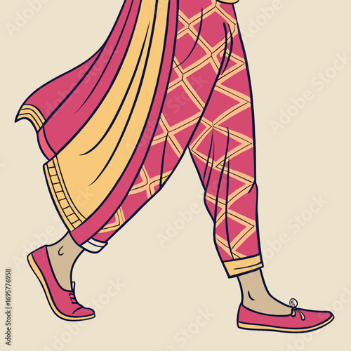 Closeup of a womans lower body wearing a traditional indian salwar kameez
