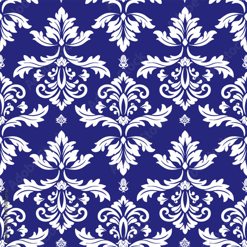 seamless floral pattern. An elegant damask pattern with white floral motifs on a deep blue background.