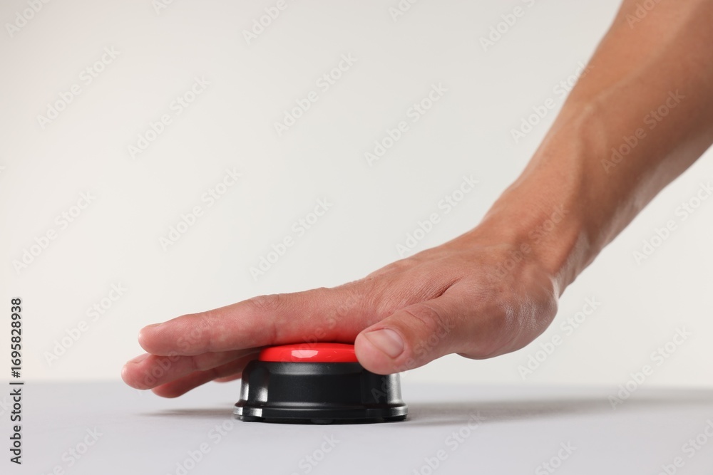 Fototapeta premium Man pressing red button on white background, closeup