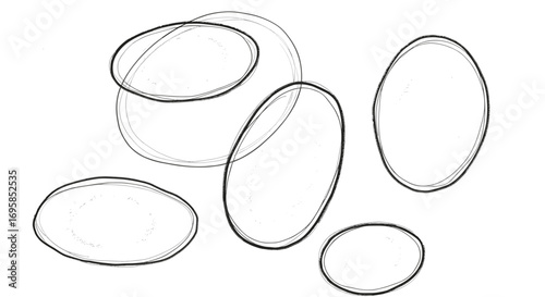 A collection of freehand sketched ellipses and circles in grayscale art