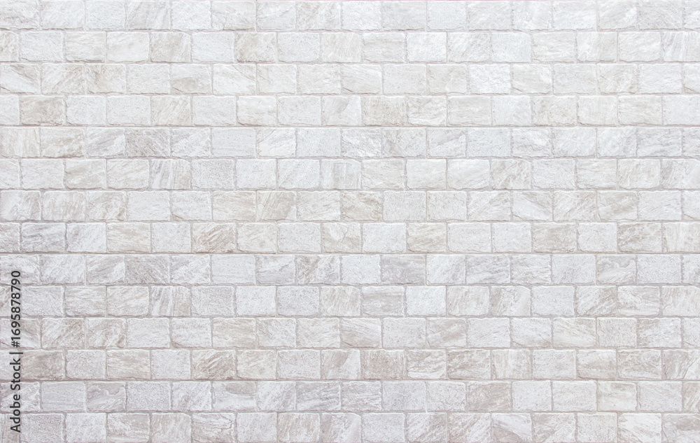 Obraz premium Detail of modern cream brick wall background photo. 