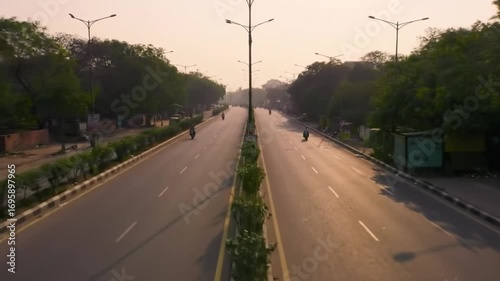 Empty road through city at dusk