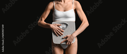 Young woman with scales on ...