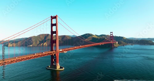 Aerial view of the Golden Gate Bridge spanning across the water with mountains in the background, San Francisco, California, United States.