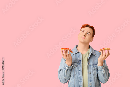 Young man holding pieces of...