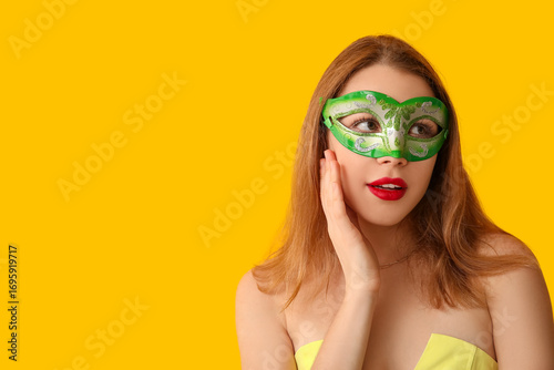 Young woman in green carniv...