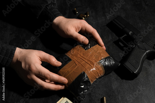 Man with drug package and g...