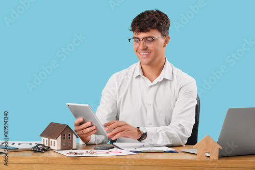 Male real estate agent work...