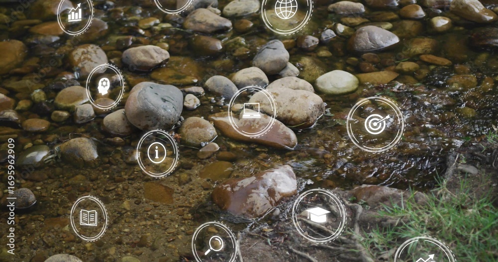 Fototapeta premium Shallow water flowing over smooth stones in woodland creek, with digital overlay icons
