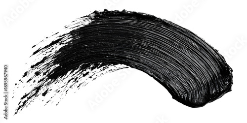 Close up of a black mascara stroke on black background.