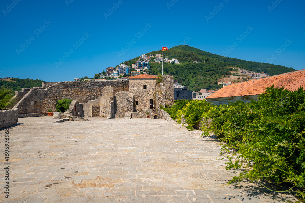 Fototapeta premium Citadel fortress and panoramic terrace in Budva, Montenegro. View of historic architecture and coastal heritage site.