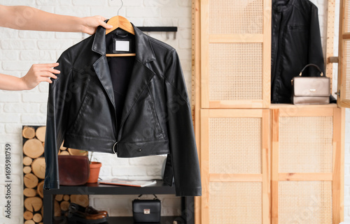 Female hands with black lea...