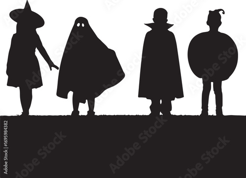 Black silhouette of four children in Halloween costumes standing on a grassy area witch ghost