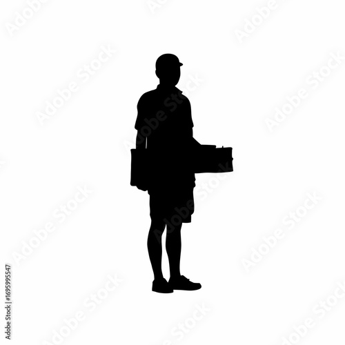 Silhouette of a street vendor selling snacks to passersby