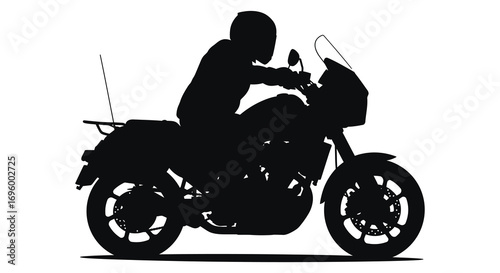 a biker riding motorcycle silhouette at night
