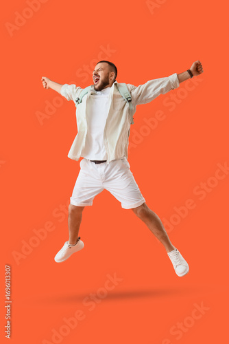 Happy young man jumping on ...