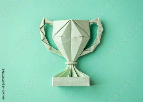 origami trophy top view on pastel green background