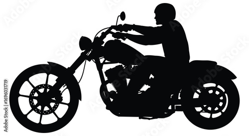 a silhouette of a man riding a classic motorcycle