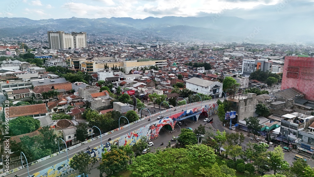 Fototapeta premium An aerial view of the Bandung cityscape featuring the Antapani Bridge. Bandung, August 30, 2025.